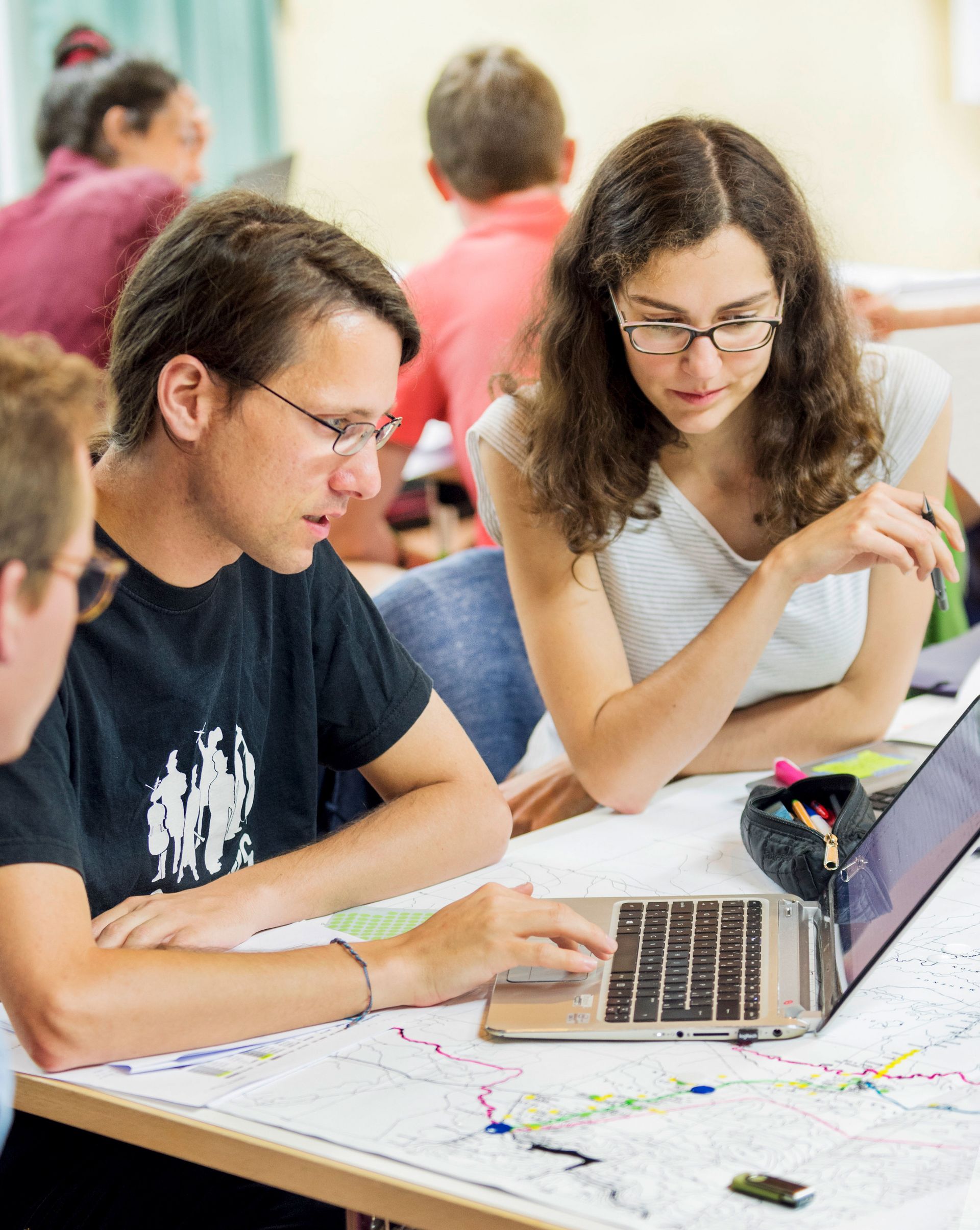 Future veterinarian Aline Steiner (right) and other students try their hand at something new: designing a fair healthcare system on a tight budget.